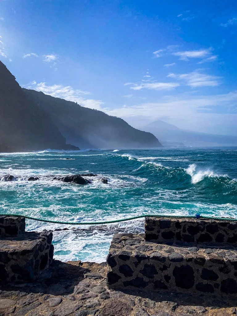 Breathtaking view of waves crashing along Tenerife's rugged coastline in the Canary Islands.
